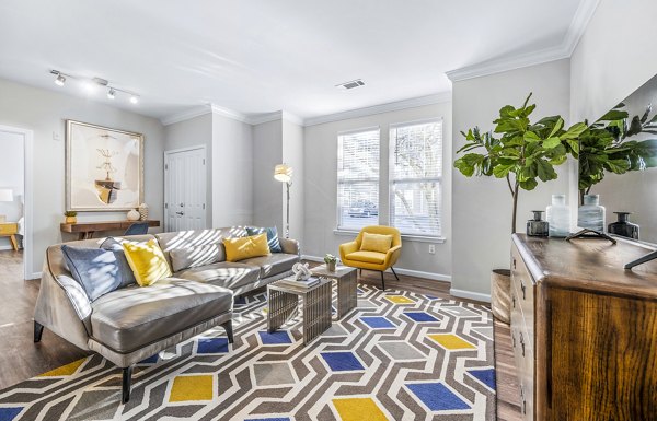 Modern living room featuring elegant decor at Jefferson at Dedham Station Apartments, offering luxury living spaces