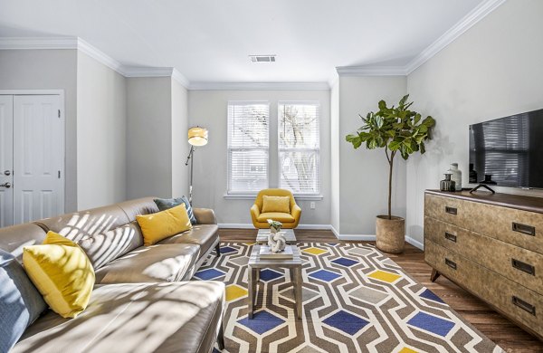 Spacious living room with modern furnishings at Jefferson at Dedham Station Apartments