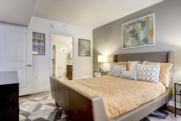 Bedroom featuring elegant design elements at 100 Capitol Yards Apartments