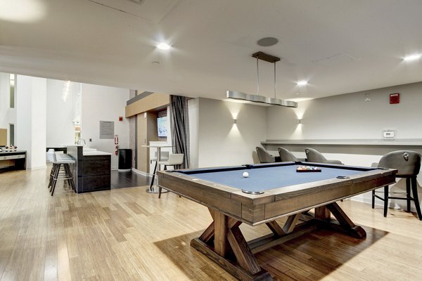 Modern clubhouse with sleek interiors at 100 Capitol Yards Apartments in Washington, DC, catering to luxurious living and relaxation