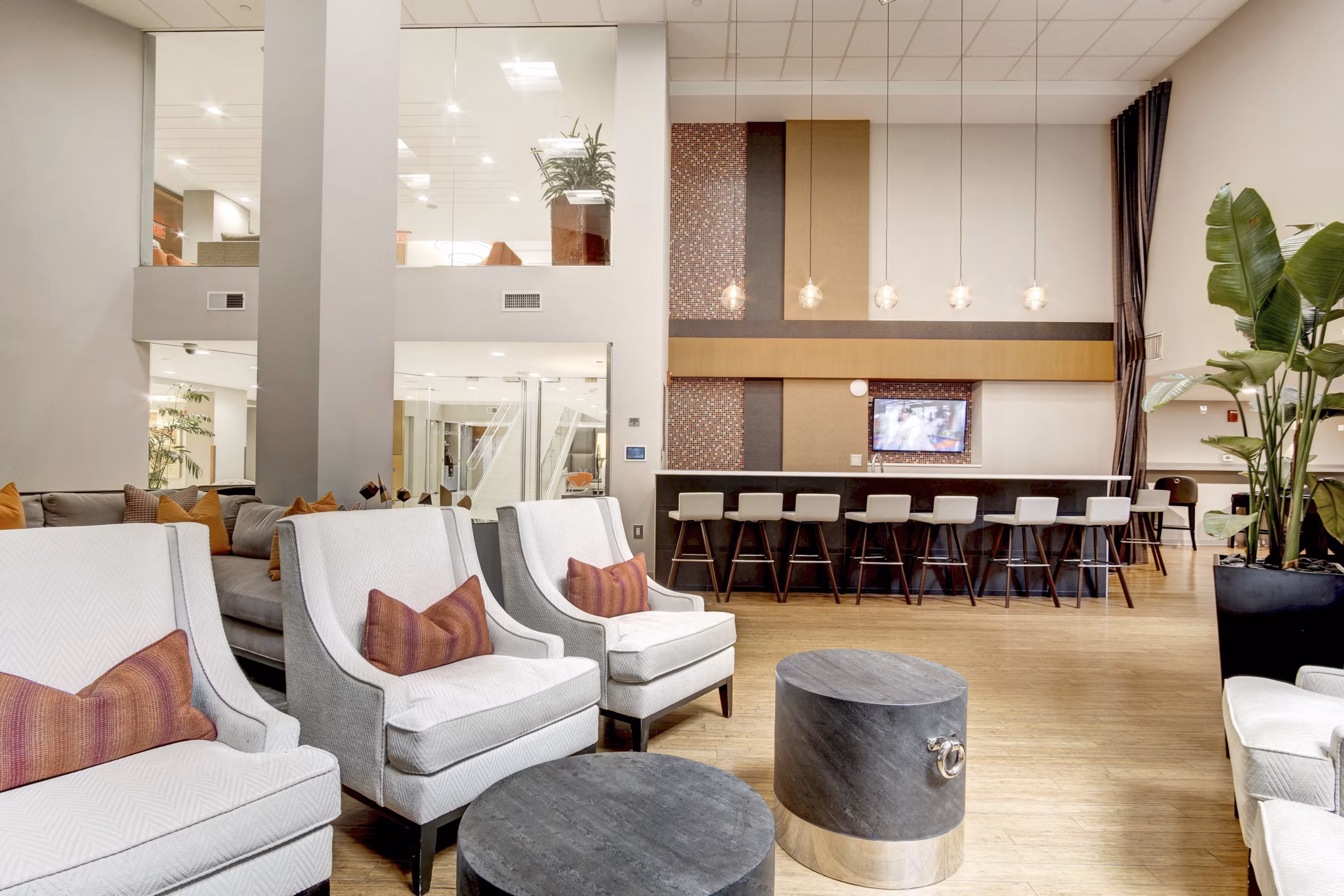 Inviting clubhouse featuring modern seating and entertainment options at 100 Capitol Yards Apartments