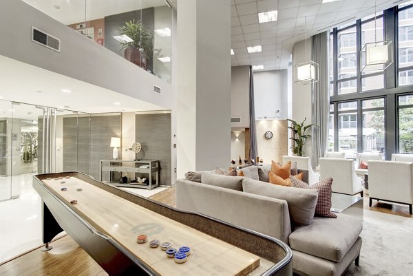 Clubhouse: Modern meeting space with stylish seating at 100 Capitol Yards Apartments