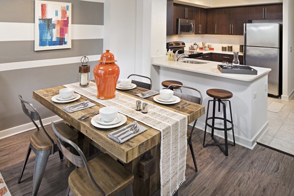 Dining area featuring modern furnishings at 100 Capitol Yards Apartments