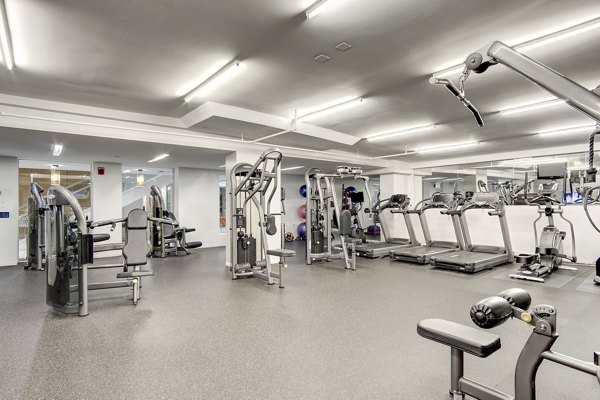 Modern fitness center at 100 Capitol Yards Apartments featuring state-of-the-art equipment