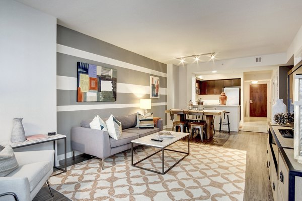 Modern living room with stylish furnishings at 100 Capitol Yards Apartments