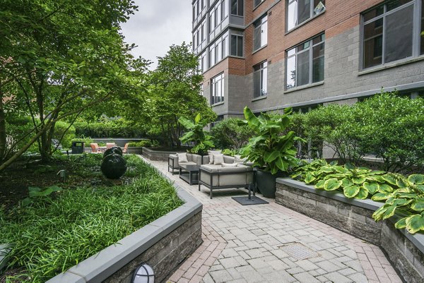 Courtyard with lush greenery at 100 Capitol Yards luxury apartments, offering a serene retreat in the heart of the city