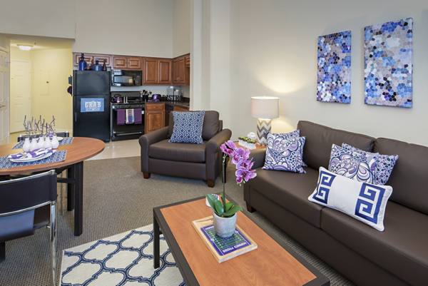 living room at GrandMarc at Westberry Place Apartments