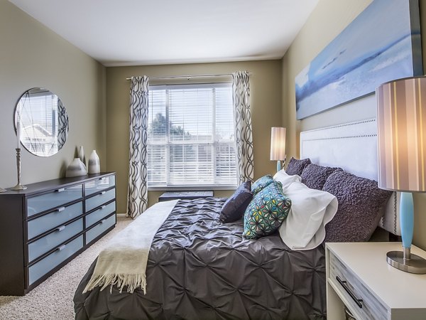 Cozy bedroom with modern design elements at  luxury apartments