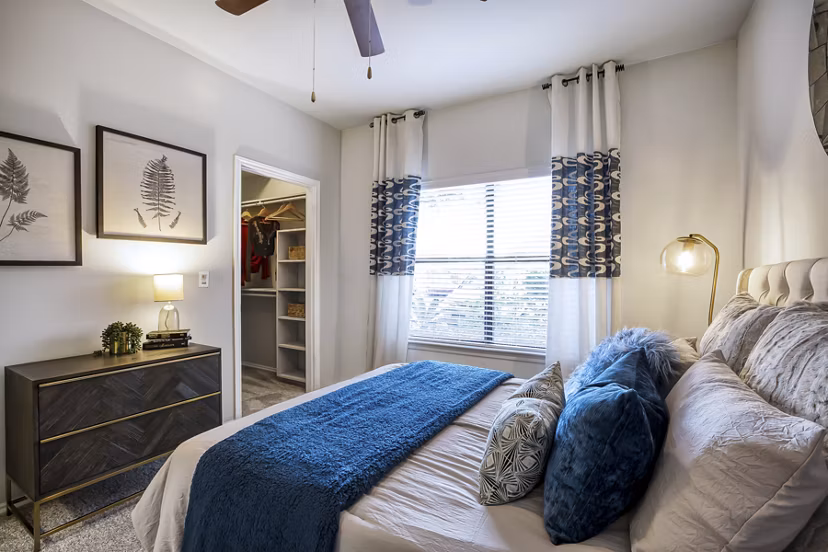 Cozy bedroom with elegant decor at Hardrock Canyon Apartments labeled as Greystar luxury apartments
