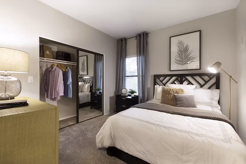Elegant bedroom with natural light at Hardrock Canyon Apartments, offering luxury living in the heart of Austin