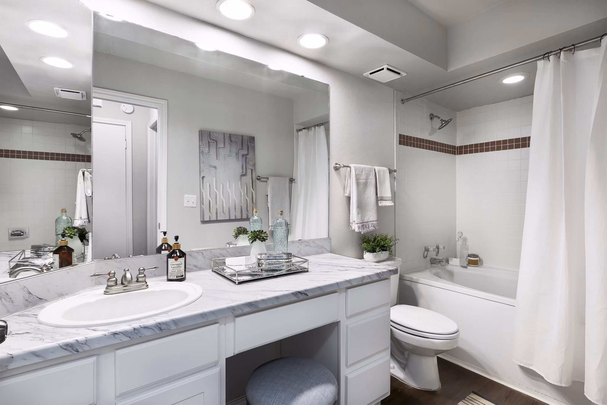 Luxurious bathroom with granite countertops and modern fixtures in Hardrock Canyon Apartments