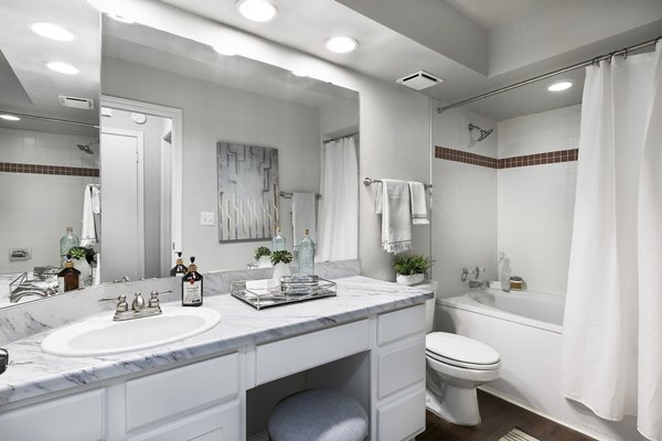 Luxurious bathroom with granite countertops and modern fixtures in Hardrock Canyon Apartments