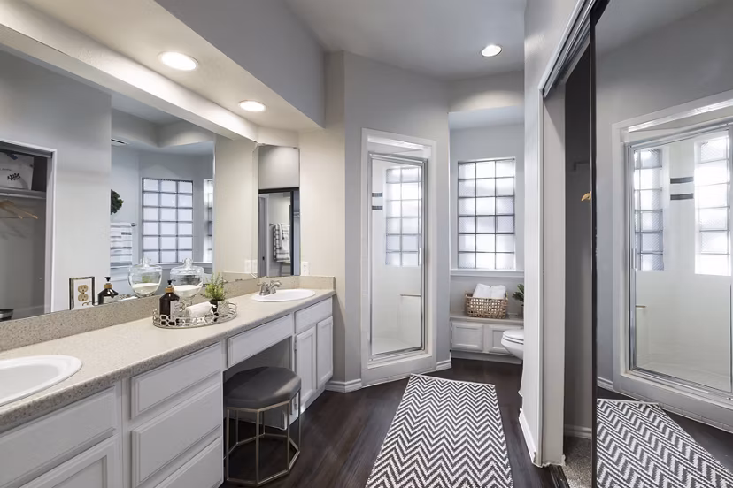 Modern bathroom with glass shower and sleek vanity in Hardrock Canyon Apartments, luxury living in Austin