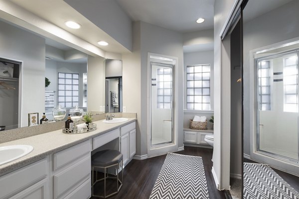 Modern bathroom with glass shower and sleek vanity in Hardrock Canyon Apartments, luxury living in Austin