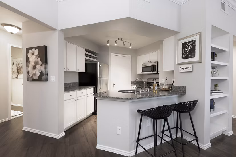 Modern kitchen with stainless steel appliances at Hardrock Canyon Apartments, a luxury living community