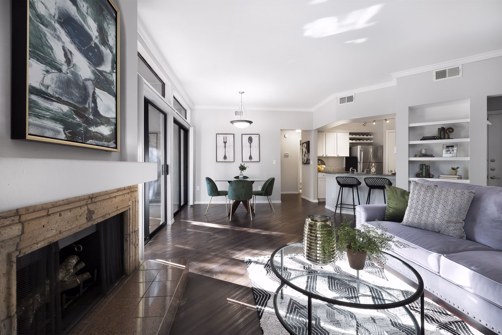 Bright living room with modern dÃ©cor at Hardrock Canyon Apartments featuring spacious seating and natural light through large windows
