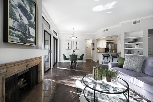 Bright living room with modern dÃ©cor at Hardrock Canyon Apartments featuring spacious seating and natural light through large windows