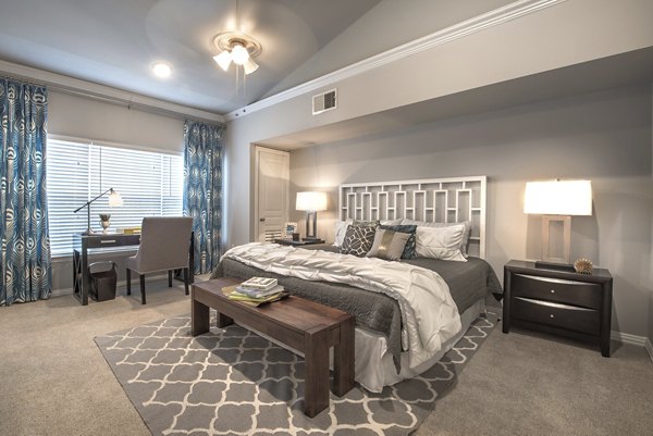 Spacious bedroom with modern furnishings at Manchester State Thomas Apartments