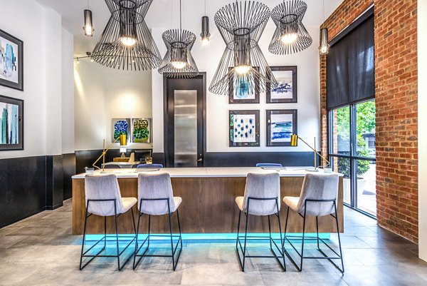 Clubhouse lobby featuring modern decor and seating at Manchester State Thomas Apartments