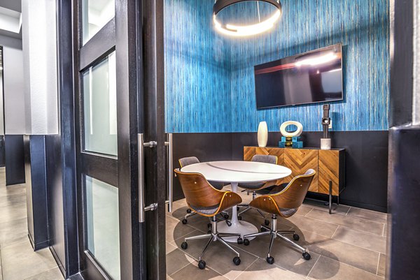 Clubhouse meeting facility with modern amenities at Manchester State Thomas Apartments