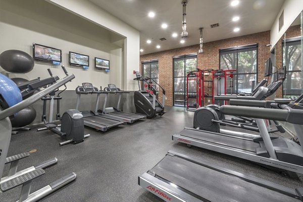 Modern fitness center with state-of-the-art equipment at Manchester State Thomas Apartments, a Greystar luxury apartment community