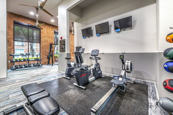 Fitness center with modern equipment at Manchester State Thomas Apartments