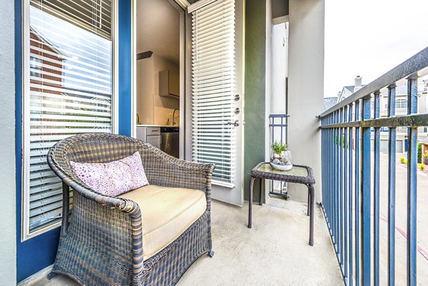 Patio with outdoor seating at Manchester State Thomas Apartments, offering luxury outdoor space for Greystar residents