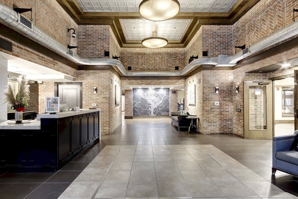 Clubhouse with modern decor and seating at 70 Capitol Yards Apartments in the luxury Greystar community