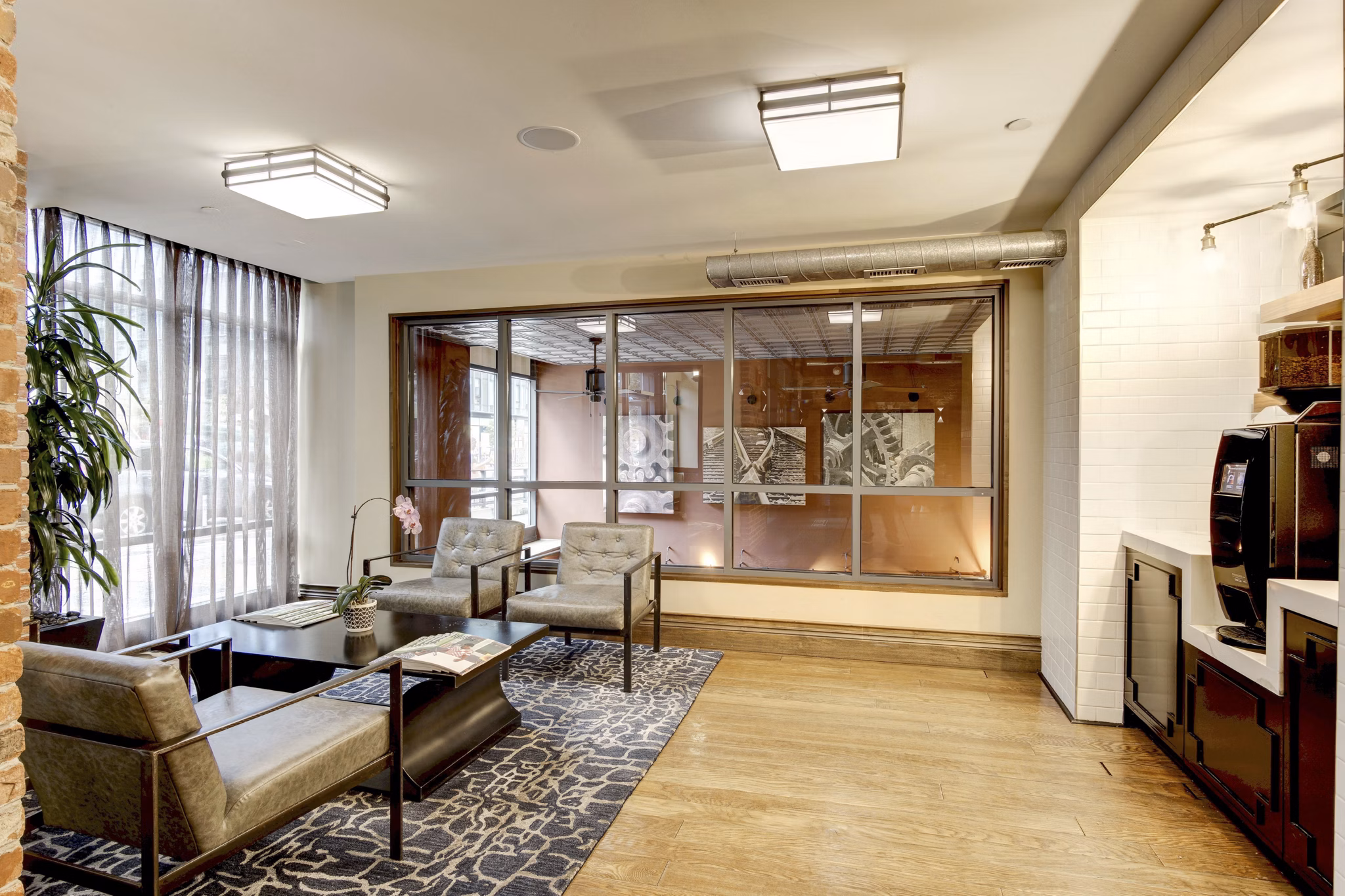 Clubhouse with modern furniture at 70 Capitol Yards Apartments, a Greystar luxury property located in an upscale community setting