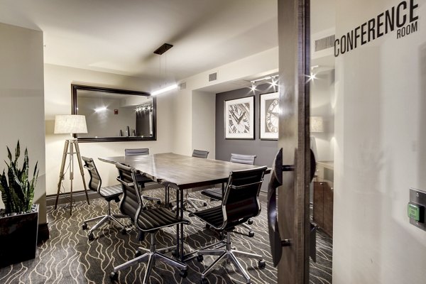 Modern meeting facility with sleek seating and presentation equipment at 70 Capitol Yards Apartments
