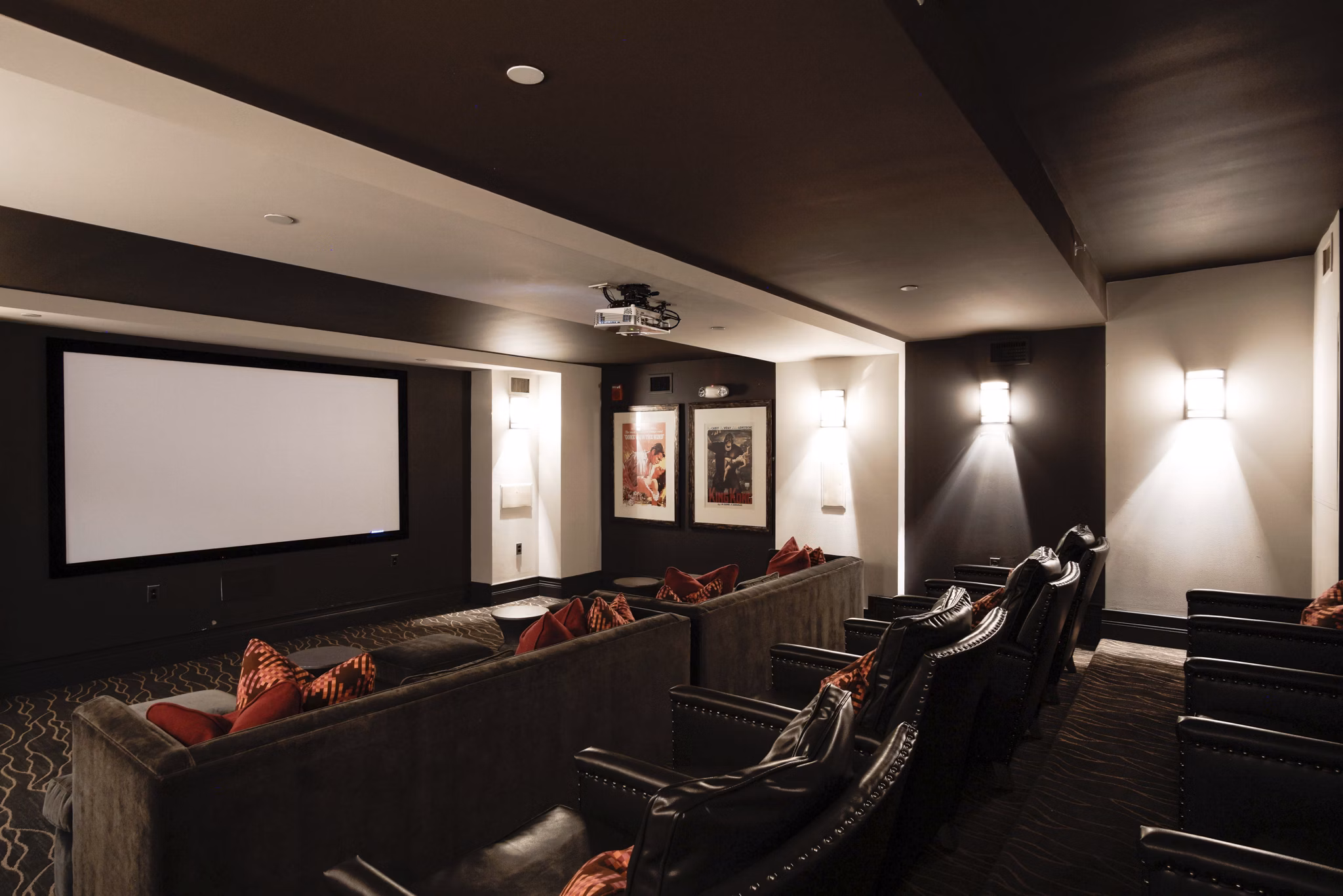 Theater room with plush seating at 70 Capitol Yards Apartments featuring a large screen for movie nights