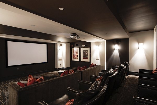 Theater room with plush seating at 70 Capitol Yards Apartments featuring a large screen for movie nights