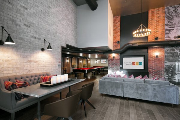 Stylish clubhouse with modern decor at 70 Capitol Yards Apartments, offering luxury amenities in a vibrant community setting