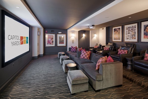 Theater room with plush seating at 70 Capitol Yards Apartments, luxury Greystar property in Washington, DC