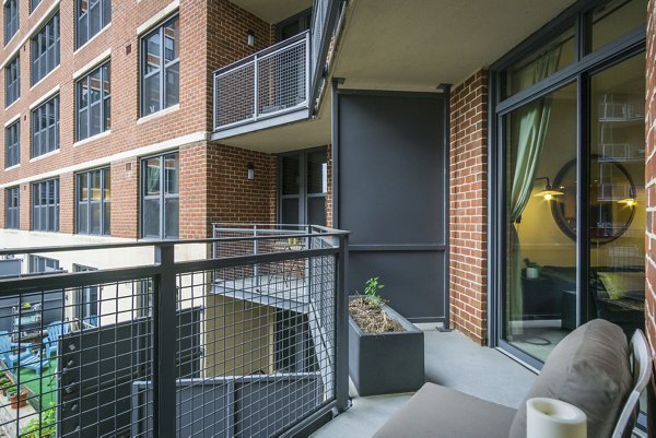 Open-air patio with contemporary seating at 70 Capitol Yards Apartments
