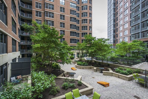 70 Capitol Yards Apartments: Lush green courtyard with seating and landscaping in Washington, DC