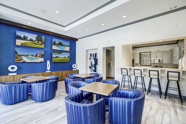 Modern clubhouse with cozy lounge and fireplace at Creekside at Highlands Ranch Apartments, luxury living in a scenic setting