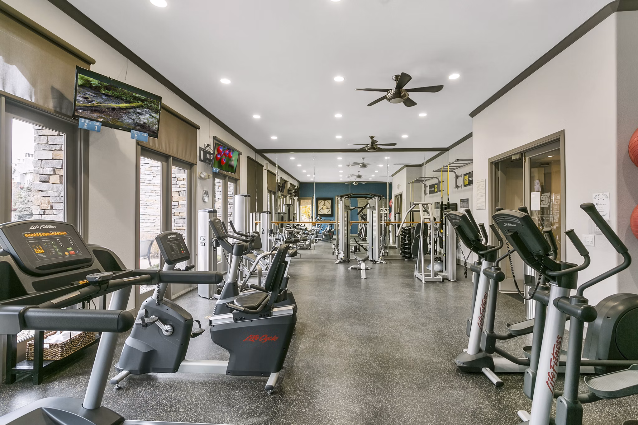 Modern fitness center with state-of-the-art equipment at Creekside at Highlands Ranch Apartments
