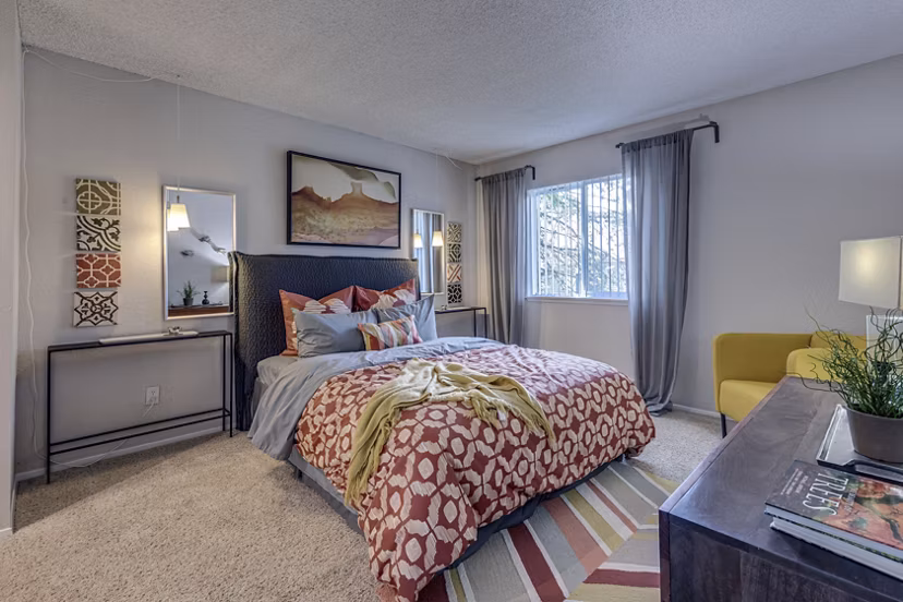 Cozy bedroom with soft lighting and plush bedding at The Berkshire Apartments, offering luxury living spaces for modern comfort seekers