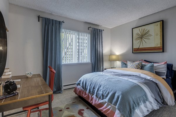 Cozy bedroom with modern decor in The Berkshire Apartments