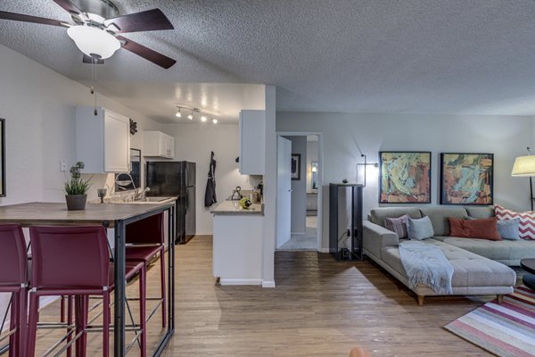 Dining room with elegant chandelier and modern decor at The Berkshire Apartments