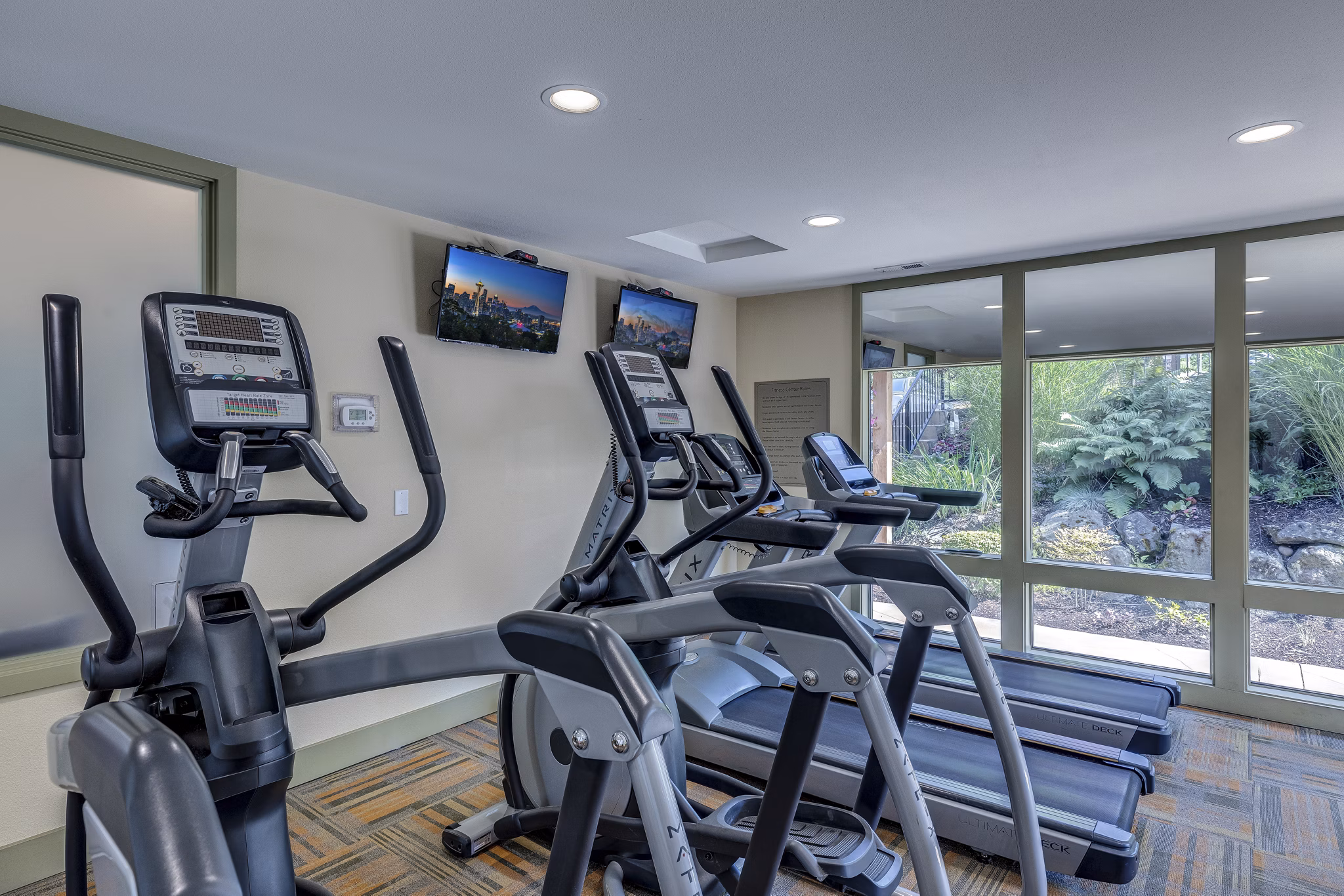 Modern fitness center with state-of-the-art equipment at The Berkshire Apartments