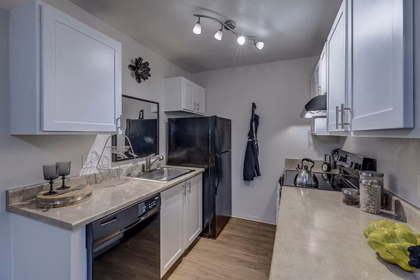 Modern kitchen with stainless steel appliances at The Berkshire Apartments