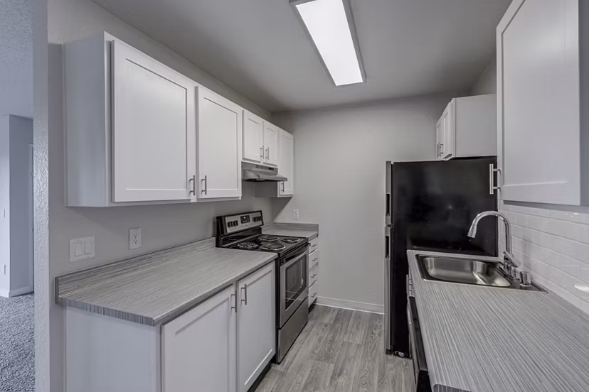 Modern kitchen with stainless steel appliances at The Berkshire Apartments