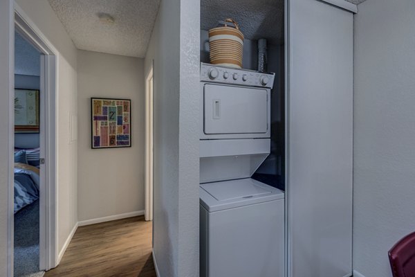 Laundry room with energy-efficient washers and dryers at The Berkshire Apartments