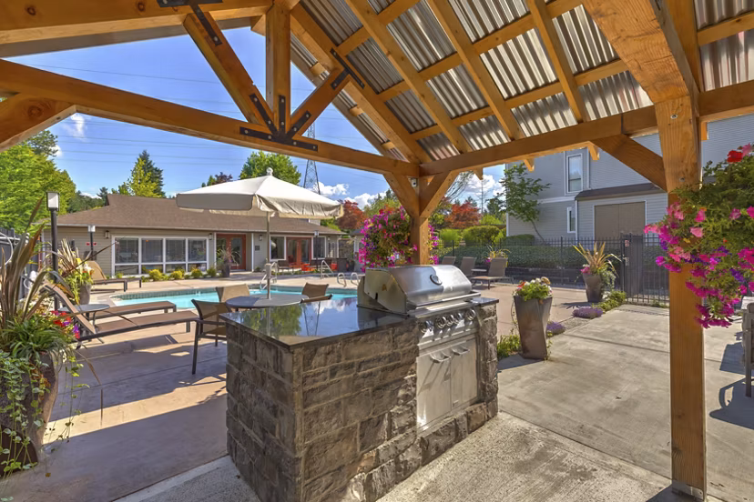 Outdoor BBQ grill area at The Berkshire Apartments offering modern amenities for residents
