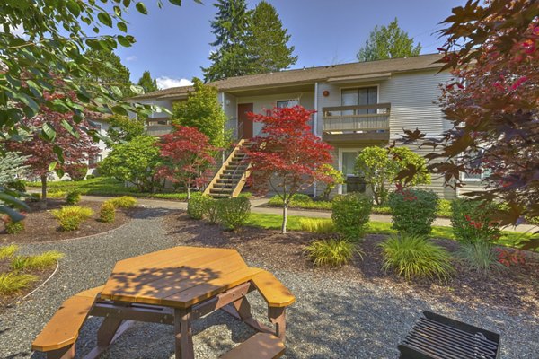 Courtyard with lush landscaping at The Berkshire Apartments featuring luxury living spaces