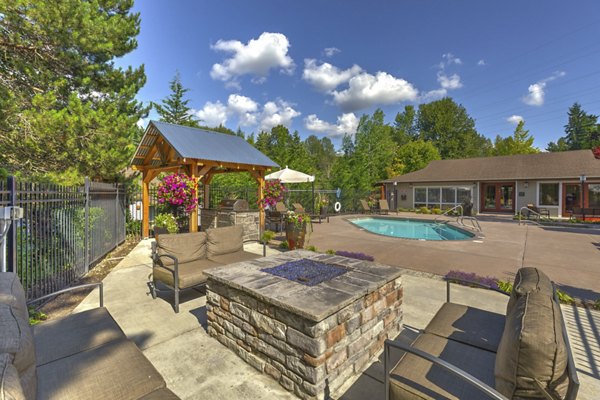 Cozy outdoor fire pit area at The Berkshire Apartments, perfect for evening gatherings