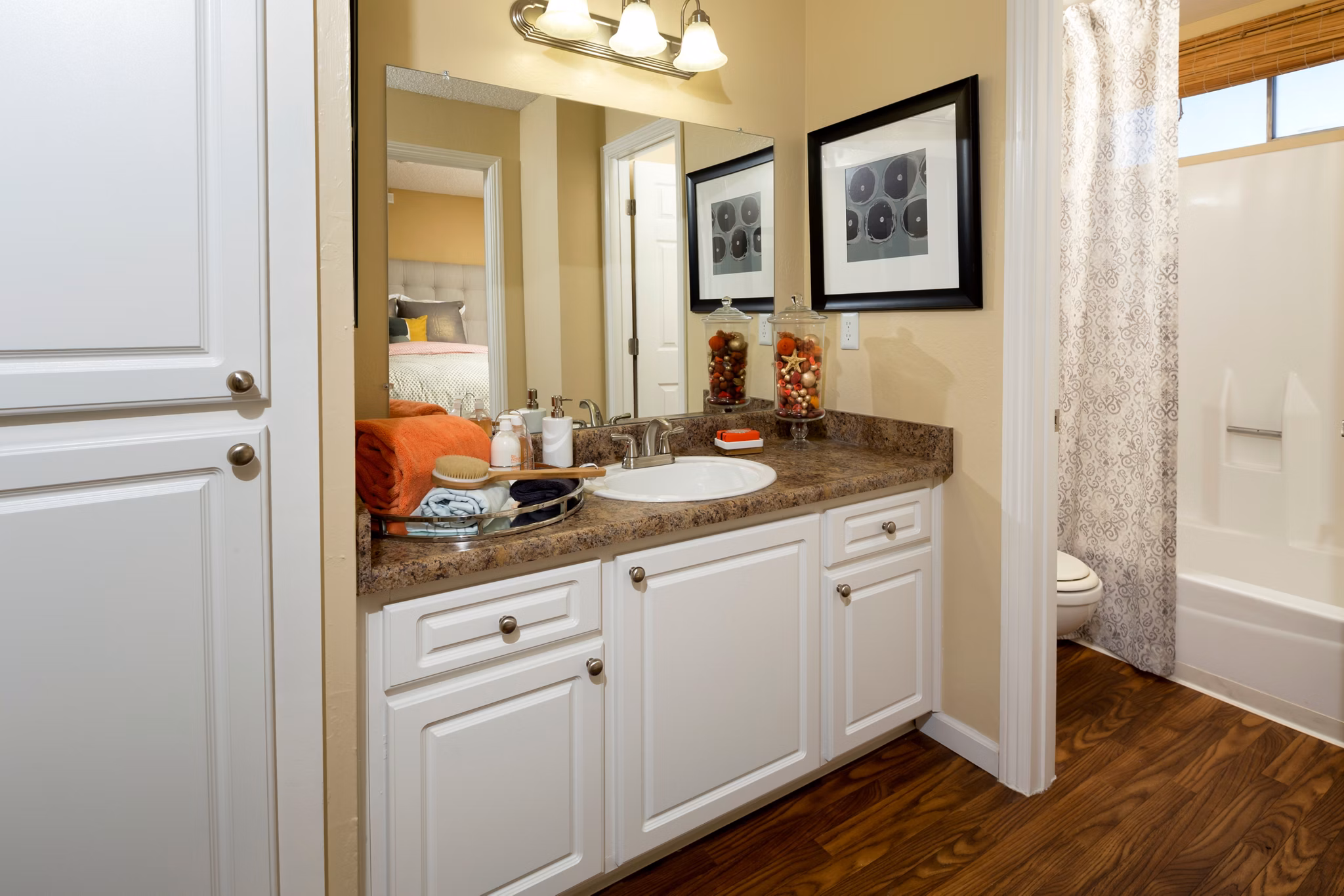 Eagle Gate Apartments: Modern bathroom with sleek fixtures and ample lighting in luxury apartments