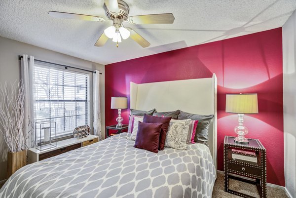 Cozy bedroom with modern decor at Stratford Station Apartments